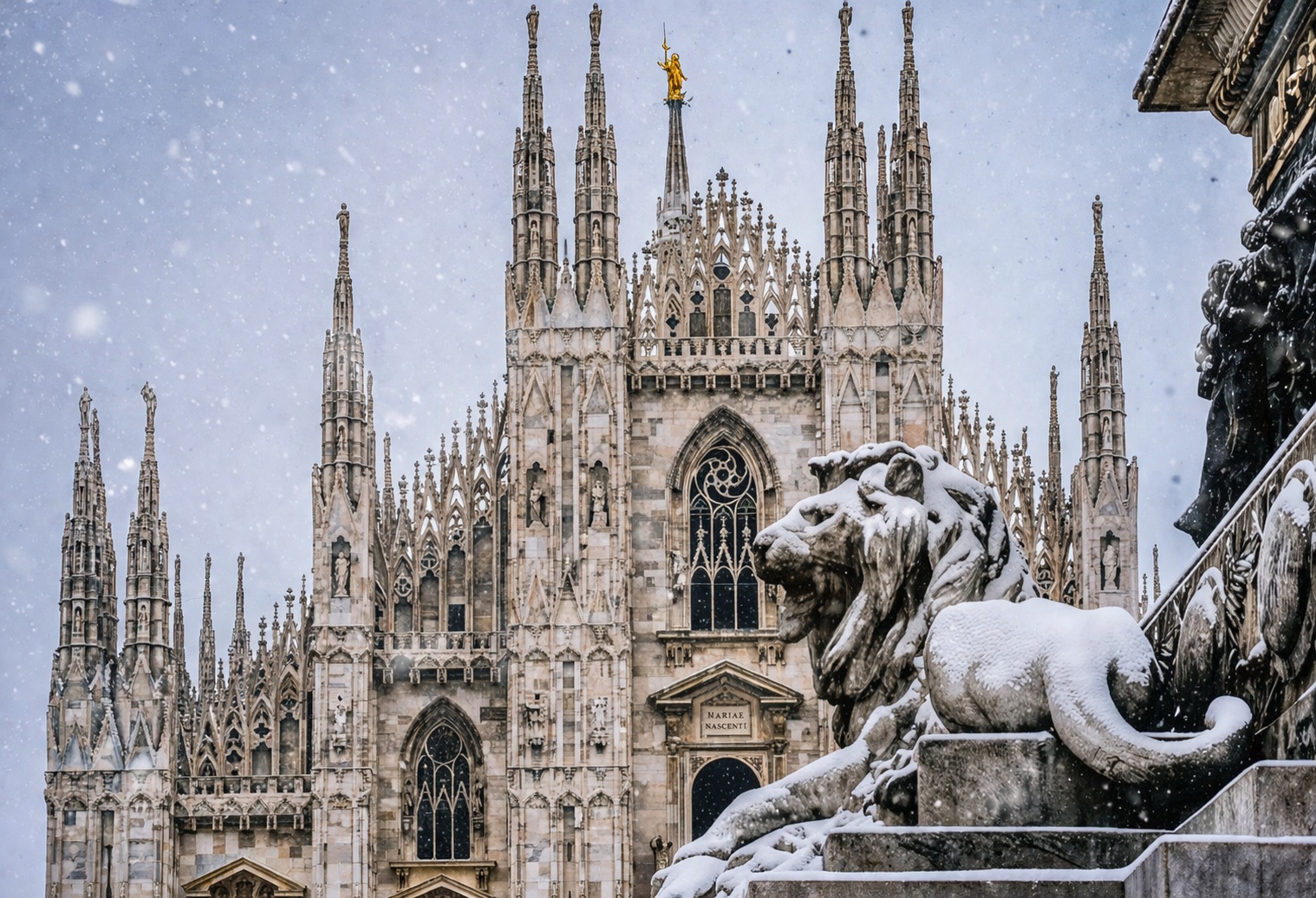Milan Duomo in the snow with a lion statue